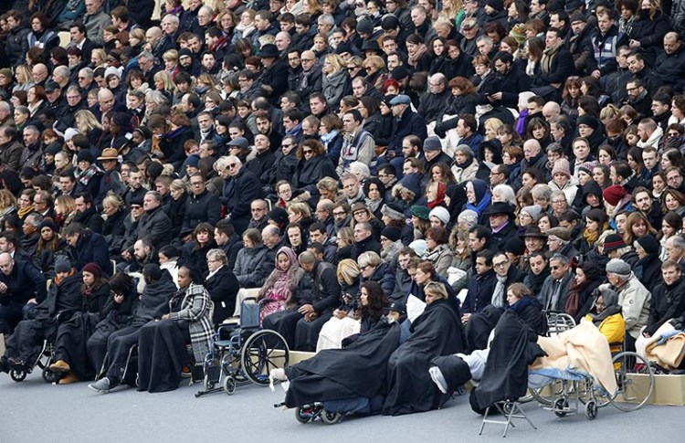 Wounded people in the Nov. 13 Paris attacks are among those waiting for the start of a ceremony honoring the victims in the courtyard of the Invalides in Paris.