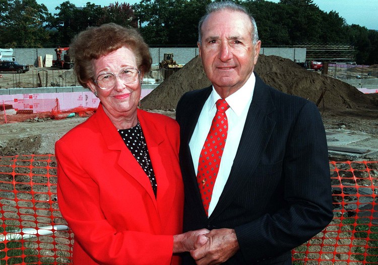 This 1997 file photo shows Melissa and Richard "Doc" Costello at the site where the University of Southern Maine field house was built in their honor. The Costellos' estate has given $1.65 million to the school to help fund improvements to the Costello Sports Complex.

