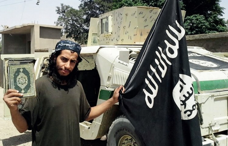This image made available in the Islamic State's English-language magazine Dabiq shows Belgian national Abdelhamid Abaaoud, who has been identified as the mastermind behind Friday's attacks in Paris. Militant photo via AP