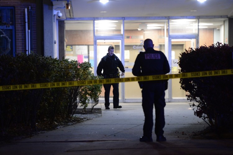 With crime scene tape blocking an entrance to Franklin Towers, Portland police investigate an apparent stabbing Monday night.
Shawn Patrick Ouellette/Staff Photographer