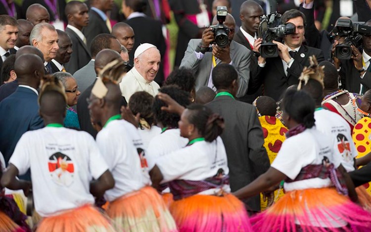 Pope Francis is greeted by traditional dancers on his arrival at the airport in Nairobi, Kenya.