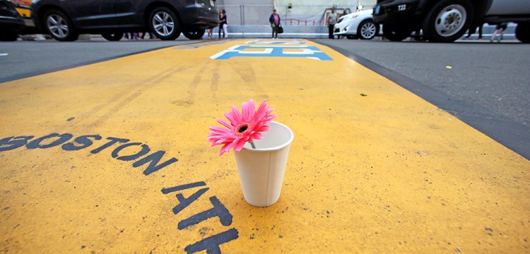 A flower in a cup stands on the finish line of the Boston Marathon after the verdict was reached in the penalty phase of the trial of Marathon bomber Dzhokhar Tsarnaev, in this May 15, 2015, photo. The Associated Press