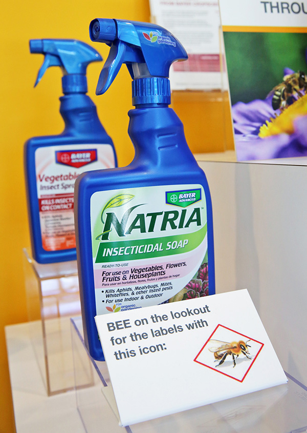 Insecticides advertised as "bee-friendly" are on display at the Bayer North American Bee Care Center. The Associated Press