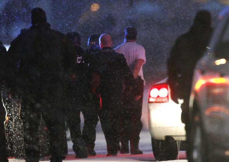 Robert Lewis Dear is taken into custody outside the Planned Parenthood clinic in Colorado Springs after a man stormed the clinic and opened fire in a burst of violence that left three people dead and nine injured, authorities said.
Reuters/Rick Wilking 