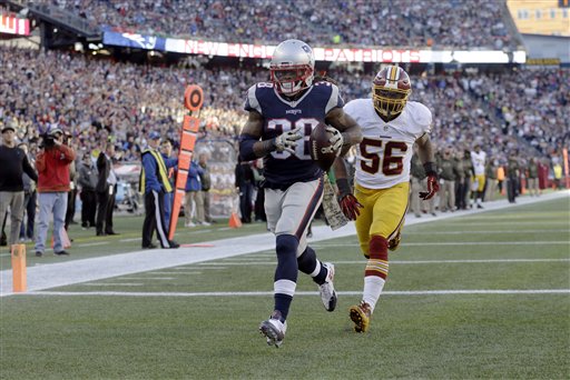 Patriots running back Brandon Bolden scores a touchdown in front of Washington linebacker Perry Riley in the fourth quarter Nov. 8.
The Associated Press 