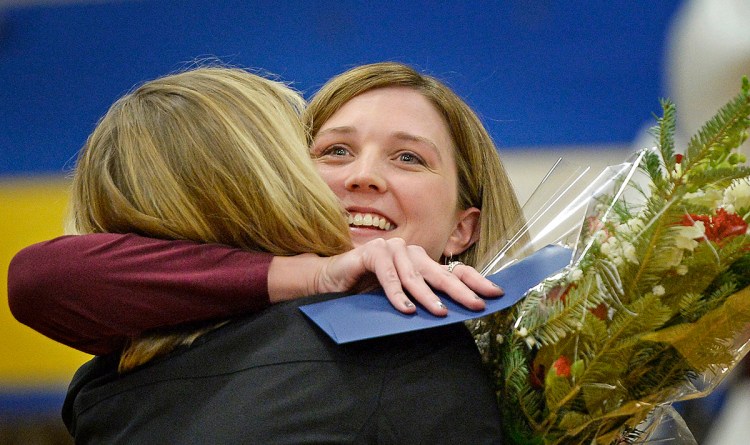 Saco Middle School eighth-grade science teacher Michaela Lamarre gets a hug from Principal Laurie Wood after Lamarre received the Milken Educator Award and $25,000 on Thursday morning. Shawn Patrick Ouellette/Staff Photographer