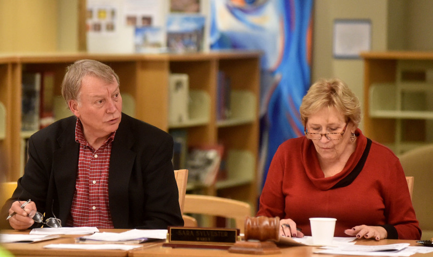 Superintendent Eric Haley, left, conducts a school board meeting at Waterville Senior High School on Wednesday night.