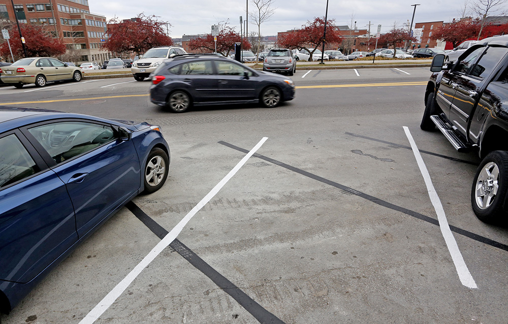 Adding to the confusion about the new angled parking spots on Spring Street, is that the lines were painted at the wrong angle initially on one side of the road.  Derek Davis/Staff Photographer