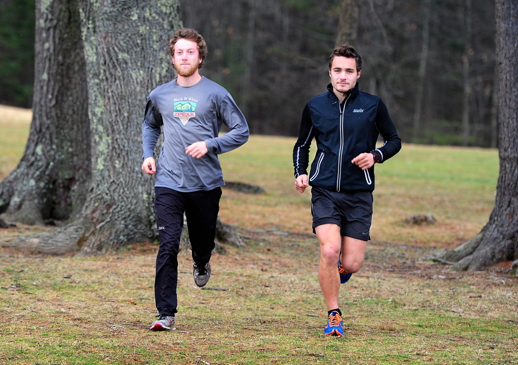 With their endurance about to be tested to the limit by multiple cross-country skiing marathons in Europe, Jackson Bloch, left, and Tyler DeAngelis prep by running the trails at Twin Brook Recreation Area in Cumberland. Gordon Chibroski/Staff Photographer