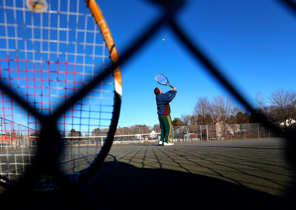 John Shea of Portland practices his serve on the tennis courts at Portland's Riverton Community Center – on Dec. 16. 