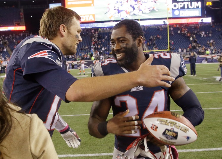 Tom Brady, left, and Darrelle Revis celebrate after a win last season. When the two met as opponents earlier this season, their greeting was as cordial. Revis left the Patriots in the offseason to return to the team he played with in the first six seasons of his career – the New York Jets. File Photo/The Associated Press