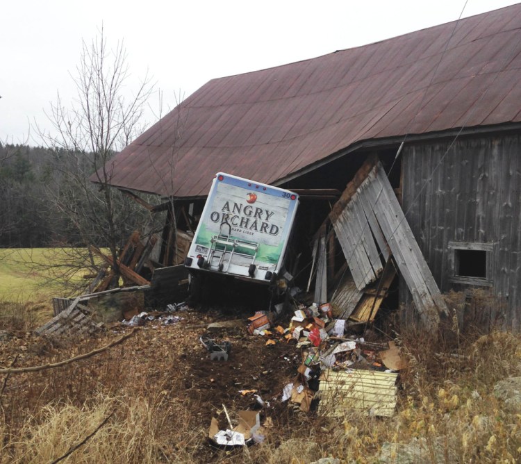 FILE – Police say this Angry Orchard truck was stolen from a Portland convenience store and spotted by a York County deputy before it crashed into a barn in Limerick on December 1, 2015.