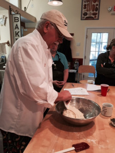 Michael Jubinsky shows students how to work with dough.