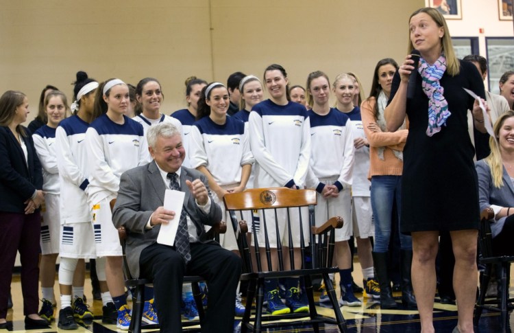 Gary Fifield laughs as one of his former players, Julie Plant, speaks at a dedication ceremony Tuesday night in Gorham. USM honored its former coach by naming the basketball court the Fifield Court at Hill Gymnasium. “It’s really, really very special,” said Fifield.