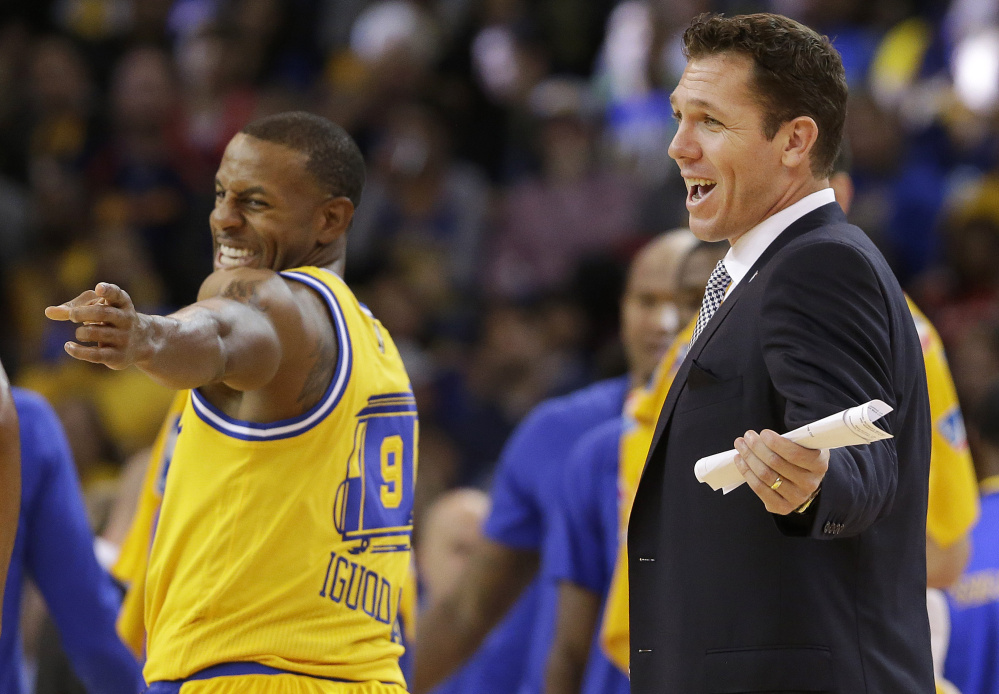 Nothing but smiles around the Golden State Warriors these days, whether it’s Andre Iguodala, left, or interim coach Luke Walton, who has run the team while Steve Kerr recovers from back surgery. Walton has learned from the best, using time while sidelined with an injury to watch and listen to Phil Jackson, his coach with the Lakers.