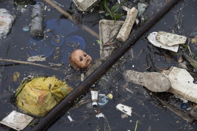 Trash floats in the Meriti River, which flows into Guanabara Bay in Rio de Janeiro, Brazil, in November.