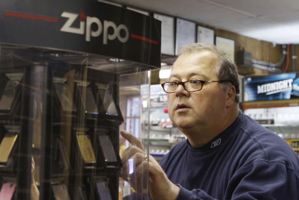 David Discatio takes inventory of lighters Wednesday. Joe's Super Variety will be closed until mid-2016, when it reopens in the first floor of a new multi-story building at the same site.
Joel Page/Staff Photographer