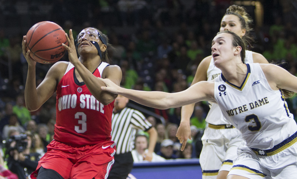 Notre Dame’s Marina Mabrey, right, fouls Ohio State’s Kelsey Mitchell during a 75-72 women’s basketball win by the Irish Wednesday at South Bend, Ind.
