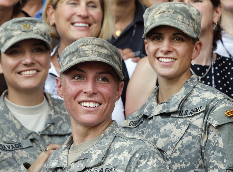 Army 1st Lt. Shaye Haver, center, and Capt. Kristen Griest, right, made history as the first female graduates of the Army’s rigorous Ranger School.