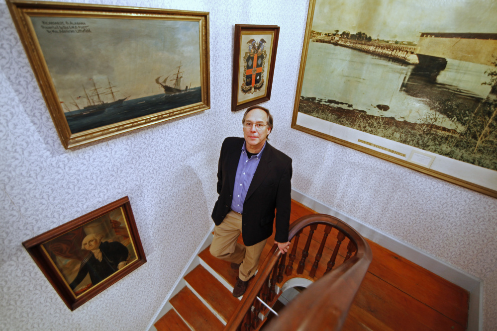 Wes LaFountain of South Portland is the new director at the Woodman Museum. Below: Butterflies from South America are part of a collection of 48 specimens at the museum.