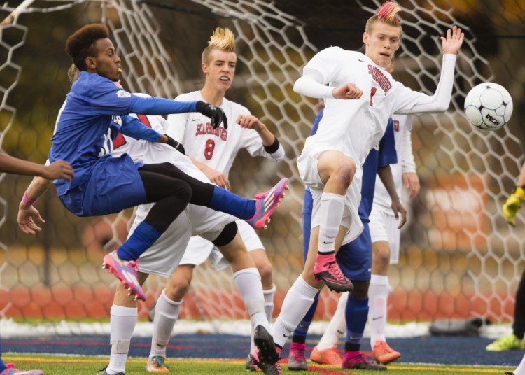 Abdi Shariff-Hassan, left, of Lewiston scored the only goal in the Class A state championship game – a win over Scarborough that capped an 18-0 season for the Blue Devils.