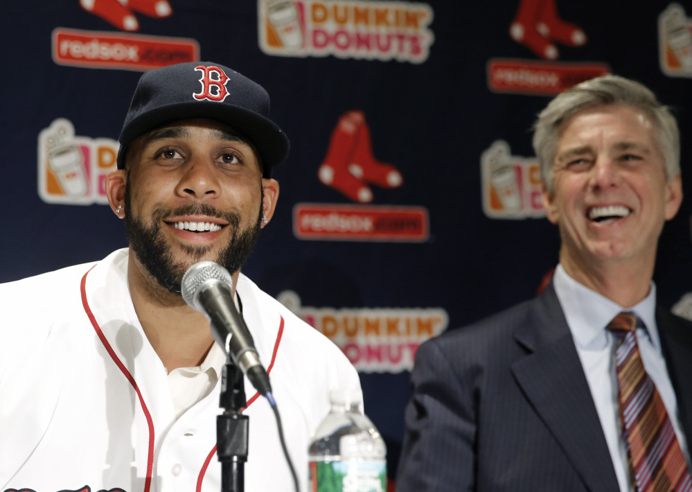 New Red Sox pitcher David Price smiles with President of Baseball Operations Dave Dombrowski at a news conference at Fenway Park announcing his signing of a seven-year contract worth $217 million.