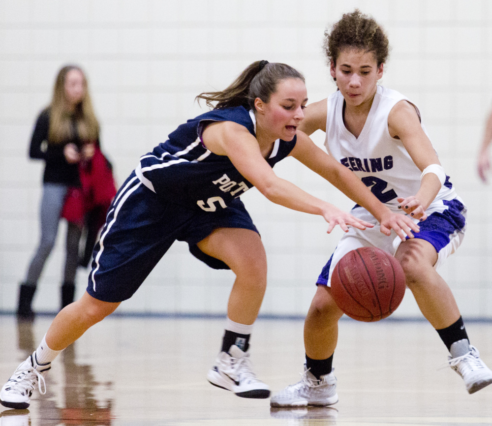 Kate Johnson of Portland and Abby Ramirez of Deering compete for a loose ball near midcourt Friday night during Deerng’s 65-47 victory in an opener at Deering High.