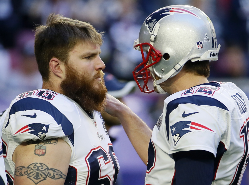 New England quarterback Tom Brady, right – talking with offensive lineman Bryan Stork – has been hit or sacked 27 times in the last two weeks. Not acceptable. But things will improve as the postseason approaches.