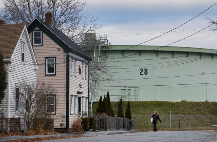 Oil tanks loom in some of South Portland’s neighborhoods, including Ferry Village. With the flow of foreign crude slowing, some wonder what the future holds for the waterfront. “At some point we have to start thinking beyond the tanks,” said City Councilor Claude Morgan. 