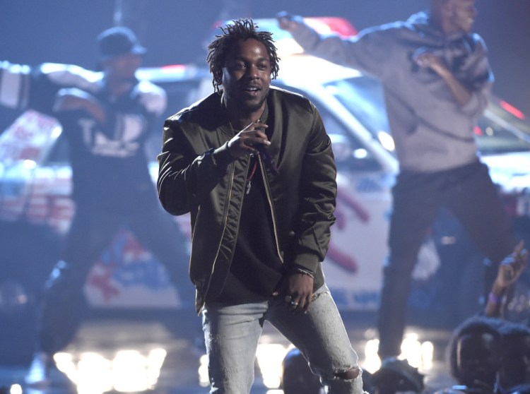 Kendrick Lamar performs at the BET Awards at the Microsoft Theater in Los Angeles in June. Lamar, Taylor Swift and the Weeknd have earned top nominations for the 2016 Grammy Awards, including album of the year.