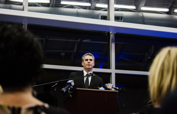 Newly inaugurated Portland Mayor Ethan Strimling makes his inaugural speech Monday night at the Ocean Gateway terminal. He told the crowd of nearly 200 people, "We must welcome change, but not as our new master.”
Whitney Hayward/Staff Photographer