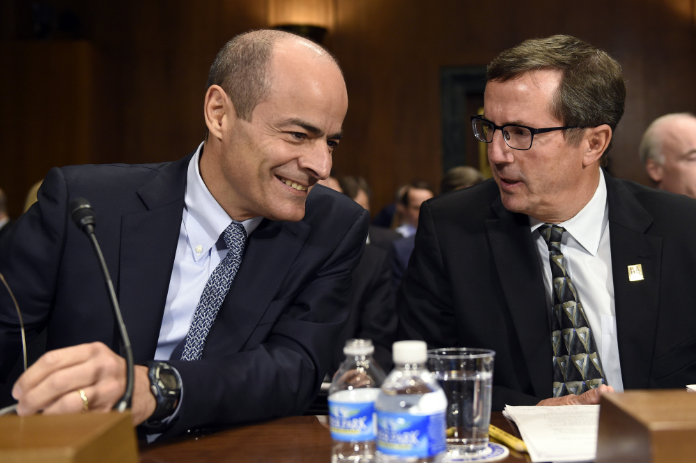 Anheuser-Busch InBev Chief Executive Officer Carlos Brito, left, told a Senate subcommittee that a merger with SABMiller will give the company access to key markets in Africa, Asia, Central and South America.
