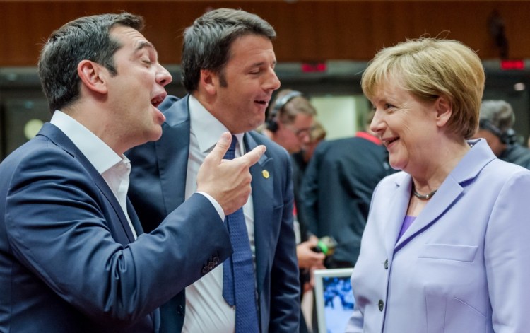 In this June 25, 2015 file photo Greek Prime Minister Alexis Tsipras, left, and Italian Prime Minister Matteo Renzi speak with German Chancellor Angela Merkel during a round table meeting at an EU summit in Brussels.