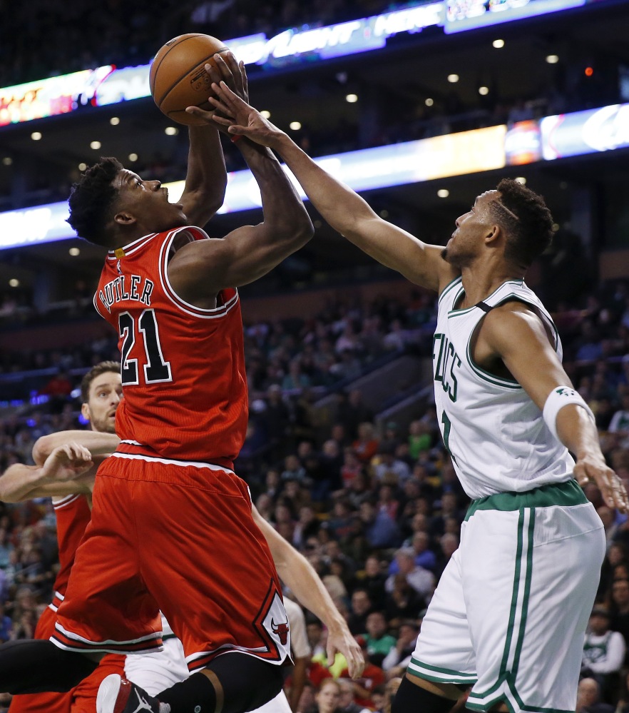 The Bulls’ Jimmy Butler shoots against the Celtics’ Evan Turner in the first half. Butler let the Bulls in scoring with a season-high 36 points.