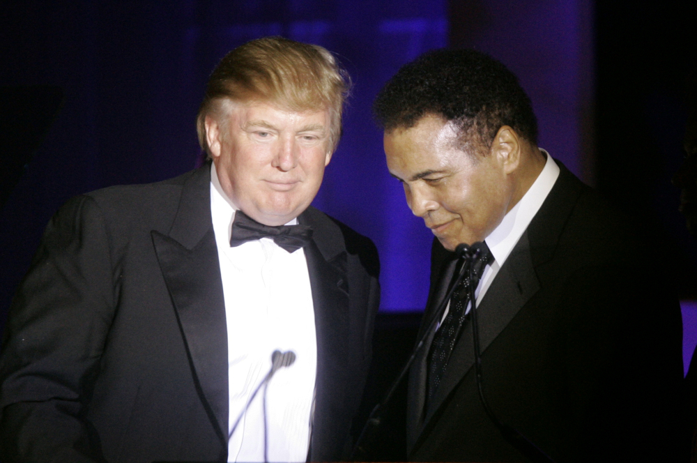 Donald Trump accepts a Muhammad Ali award from Ali in 2007. Ali issued a statement Wednesday criticizing Trump’s proposal to ban Muslims from entering the United States, and calling on Muslims “to stand up to those who use Islam to advance their own personal agenda.”