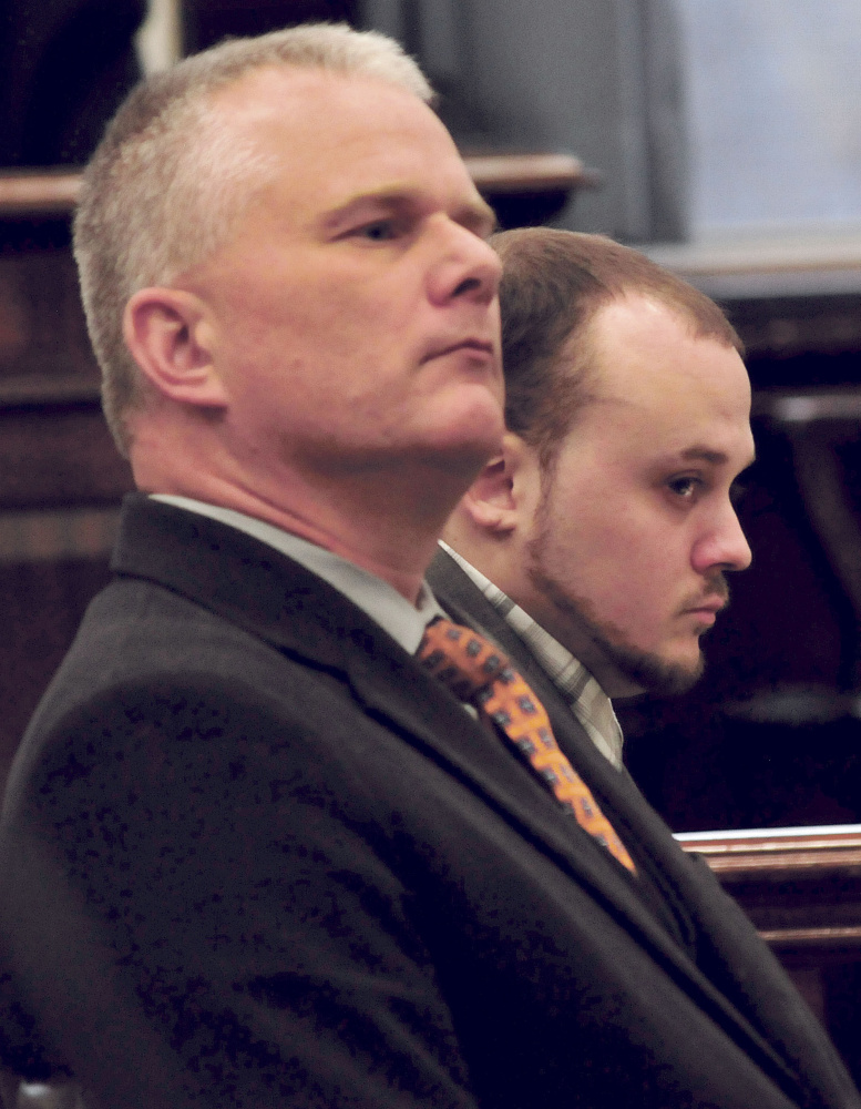Defendant Jason Cote, right, listens to court proceedings with one of his attorneys, Stephen Smith, on Thursday in Somerset County Superior Court in Skowhegan.