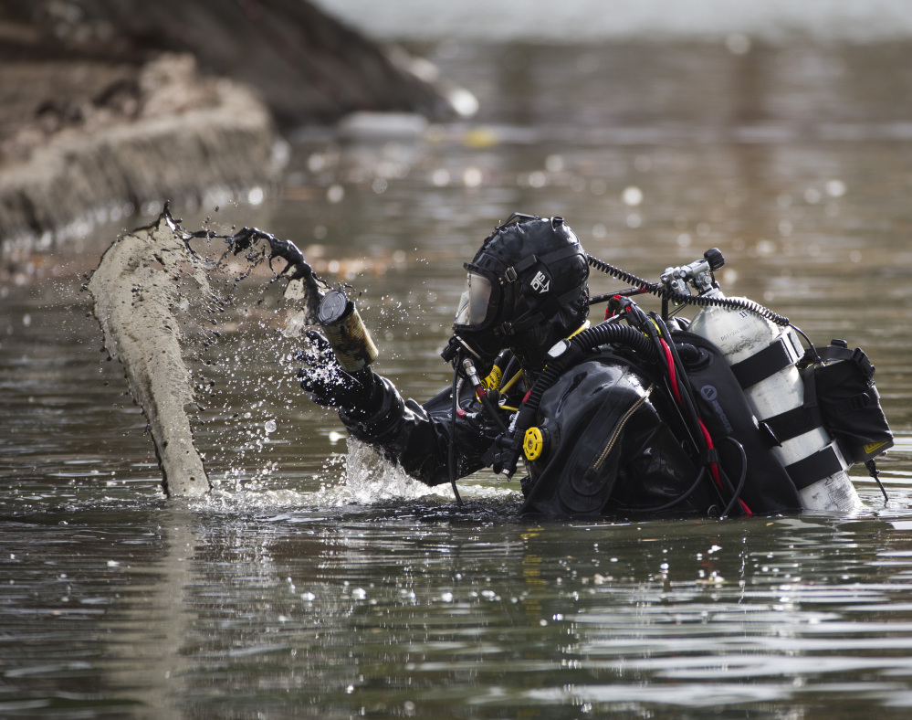 An FBI dive team on Friday continued searching Seccombe Lake for evidence linked to last week’s terror attack in San Bernardino, Calif.