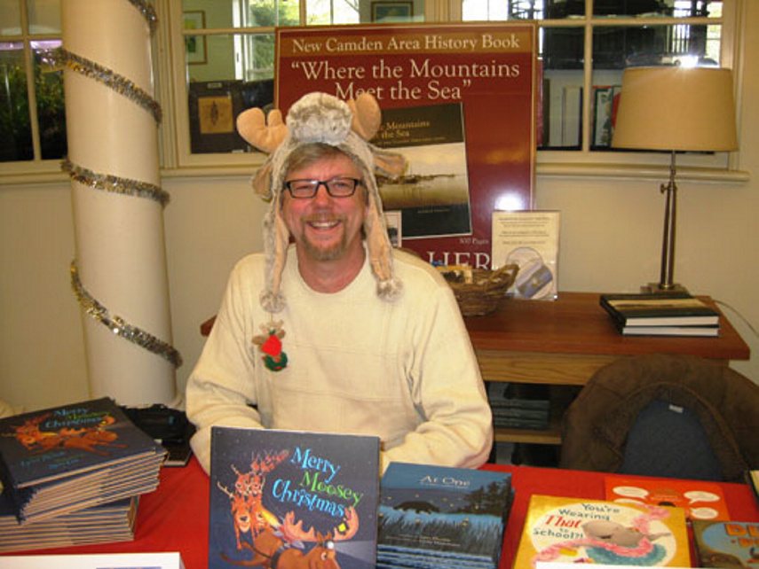 Children's author and illustrator Russ Cox poses during last year's Ho Ho Holiday Book Fair at the Camden Public Library. He will be on hand to sign copies of his book and meet with readers this Sunday. Photo Courtesy Ken Gross