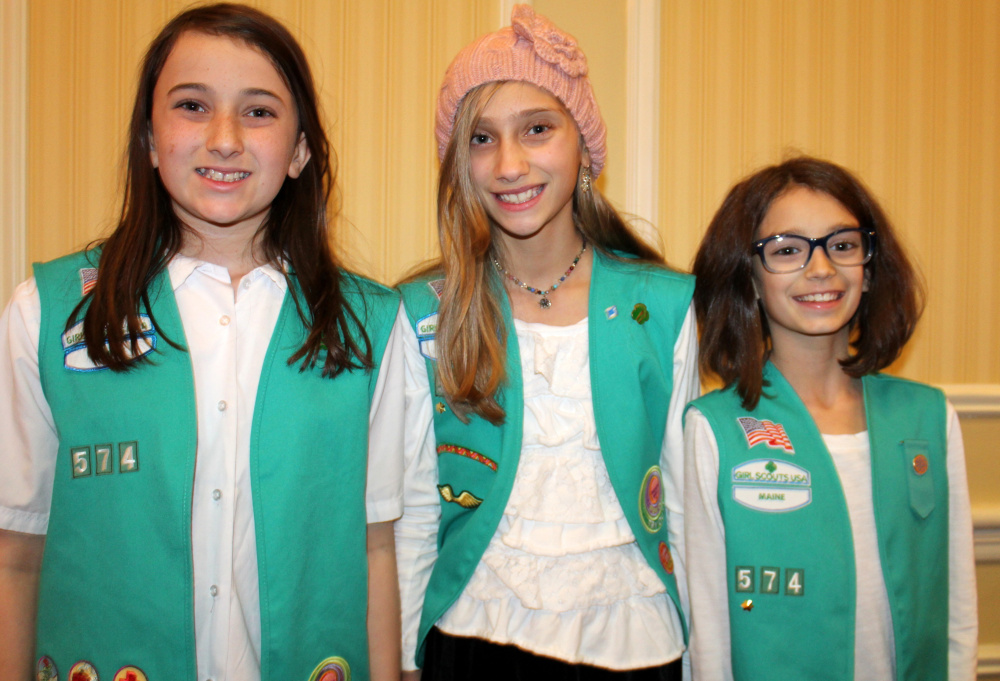 Lilly Theriault, left, Hannah Tardiff and Gwendolyn Catalano of Troop 574 in Westbrook.