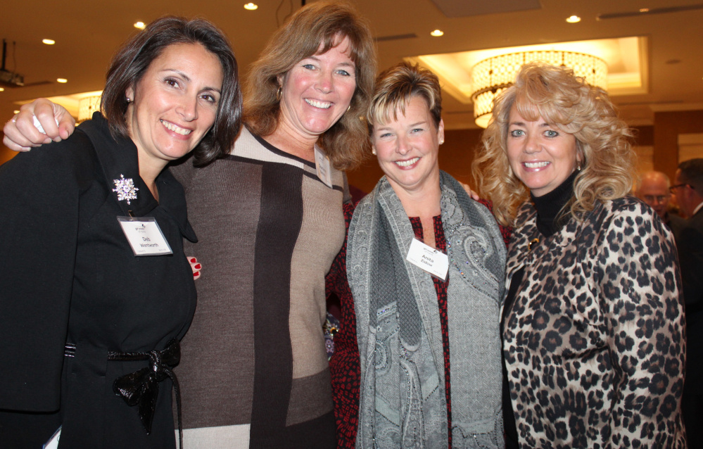 Deb Wentworth, left, Charlene Batista, Anita Zidow and Shannon Gorman at the event that raised $128,000 to help Maine girls take part in scouting.
