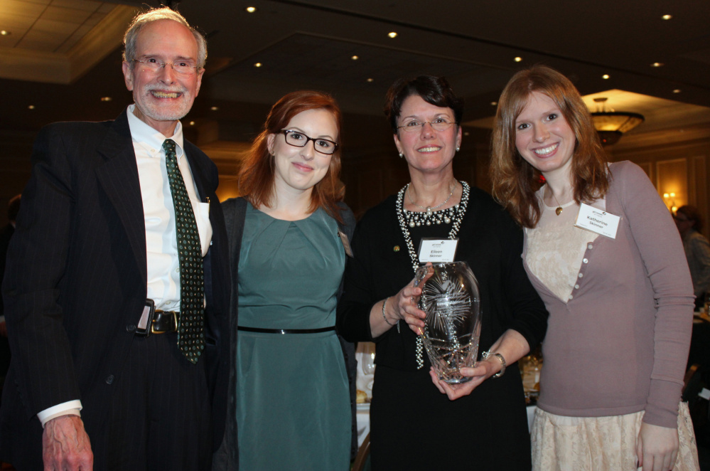 Eileen Skinner, with her husband, John, and daughters Amanda, left, and Katherine at the recent Girl Scouts of Maine gala, where she received the 2016 Woman of Distinction Award.
