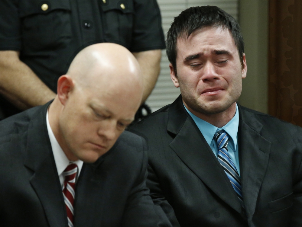 Daniel Holtzclaw, right, a former Oklahoma City police officer, cries as he is found guilty of sex crimes against eight women during his trial in Oklahoma City on Thursday.
