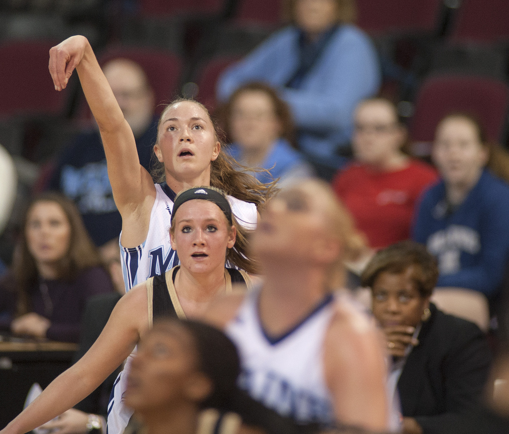 Sigi Koizar of the University of Maine watches her 3-point shot glide to the basket Saturday in the first half of the 76-38 victory against Bryant at the Cross Insurance Center in Bangor. Koizar led Maine with 18 points.
