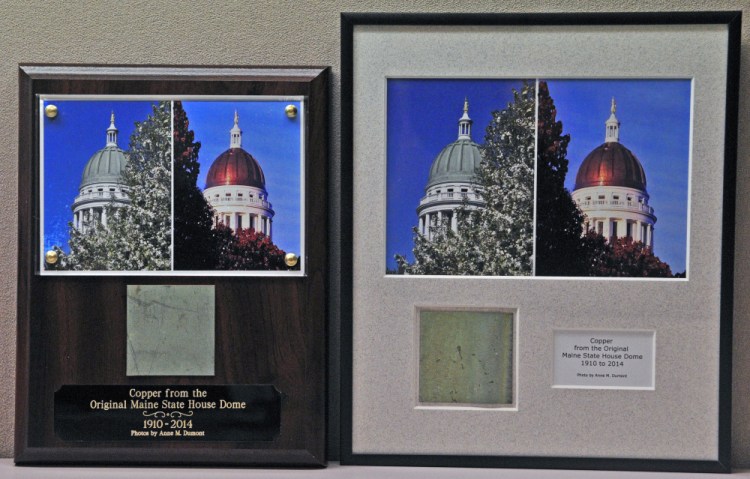 These plaques in the State House hold a piece of old State House dome copper.