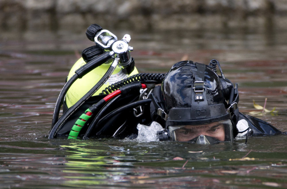 An FBI diver searches Seccombe Lake Friday following leads that Syed Rizwan Farook and Tashfeen Malik visited the area prior to their rampage.