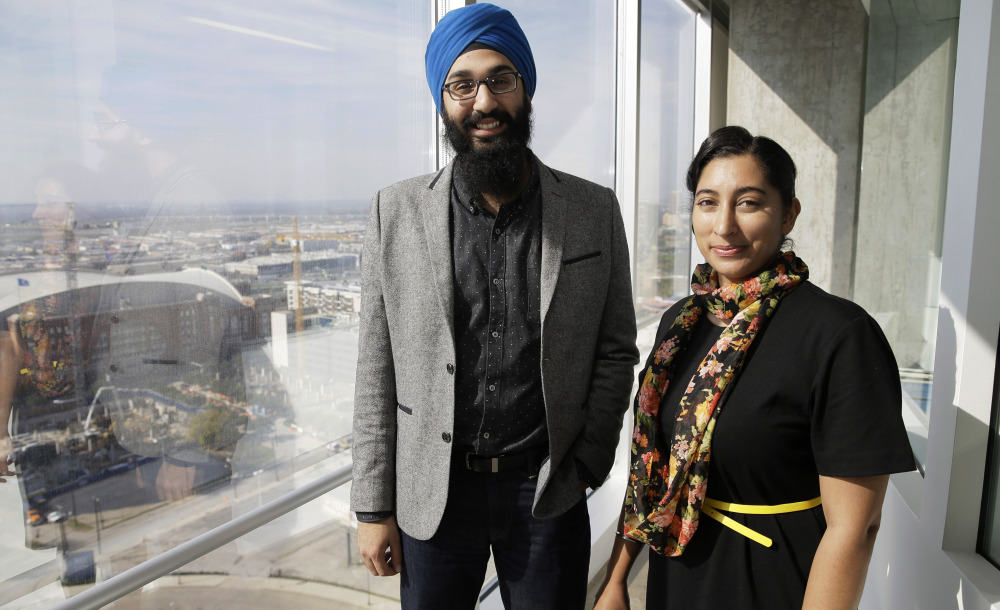 Darsh Singh, left, poses for a photo with his wife, Lakhpreet Kaur, in Dallas.