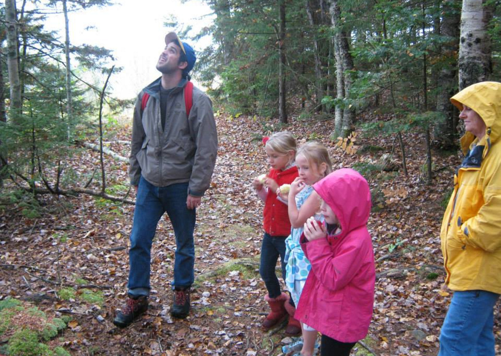 Merryspring Nature Center Director Brett Willard takes a school group on a nature walk at the 66-acre nonprofit refuge in Camden. On Saturday, the center will host a Winter Wassail event to celebrate the winter solstice and the great outdoors.