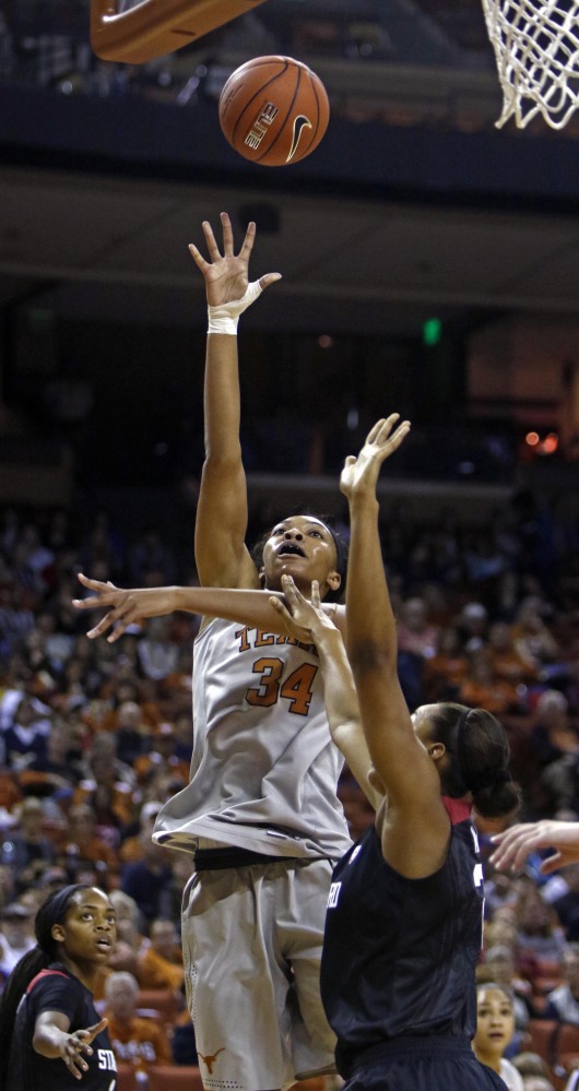 Texas center Imani Boyette shoots against Stanford forward Erica McCall during the first half of the Longhorns’ 77-69 win on Sunday in Austin, Texas.