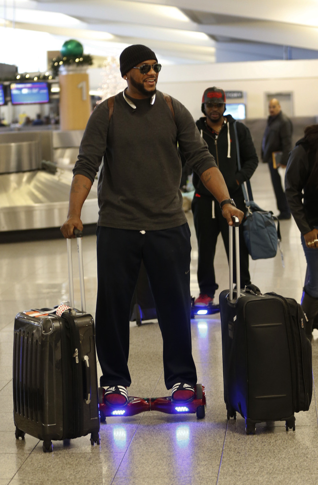 Carlos Dean rides on a hoverboard at Hartsfield- Jackson Atlanta International Airport on Friday in Atlanta. Almost a dozen airlines, including Delta, American and United, said Thursday they are banning hoverboards because of the potential fire danger from the lithium-ion batteries that power the devices.