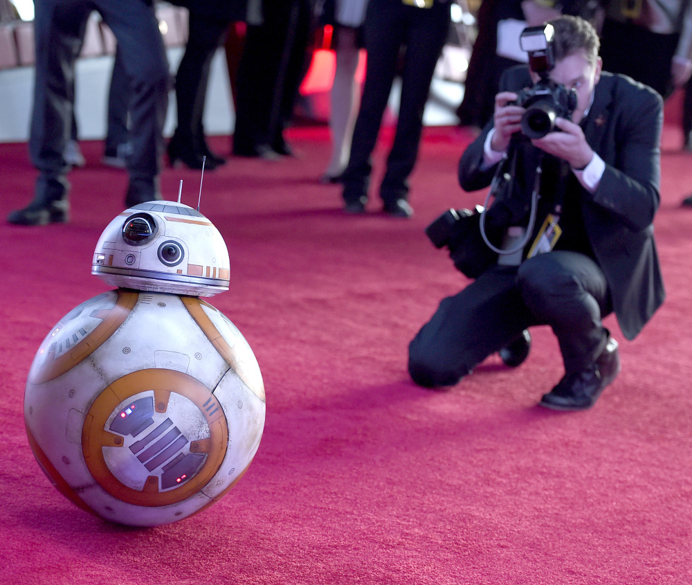 Film character BB-8 arrives at the world premiere of “Star Wars: The Force Awakens” in Los Angeles on Monday at what could be the largest movie premiere event in history.